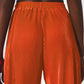 Satin pleated wide leg pants in orange