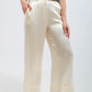 Pantalón de traje pernera ancha de raso en color crema