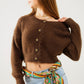 Q2 Short and fluffy brown cardigan with flower buttons