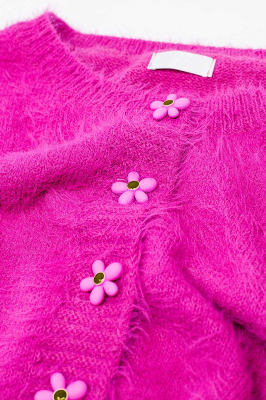 Short and fluffy pink cardigan with flower buttons