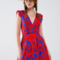 Short Dress In Red With Blue Floral Print And V-neck