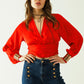 Short red crop top with long and wide sleeves