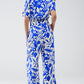 Short Sleeve Key Hole Front Floral Jumpsuit In Blue