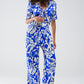 Short Sleeve Key Hole Front Floral Jumpsuit In Blue