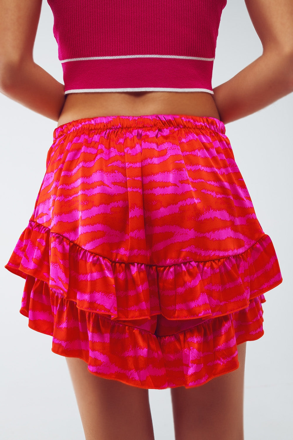 Shorts With Frilly Hem In Zebra Print In Orange And Fuchsia