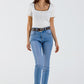 Skinny jeans in washed blue with strass all over the front