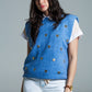 Q2 Sleeveless sweater in blue with silver sequin hearts