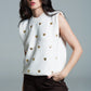 Q2 Sleeveless sweater in white with silver sequin hearts