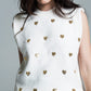 Sleeveless sweater in white with silver sequin hearts