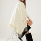 Q2 Soft knitted poncho in beige with fringes