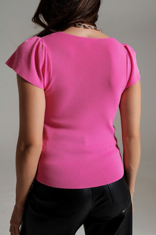 Jersey rosa con cuello cuadrado y mangas abullonadas