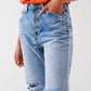 Sraight-leg jeans with exposed buttons and ripped knees in light wash