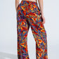 Pantalones rectos con estampado floral multicolor en tonos rojos