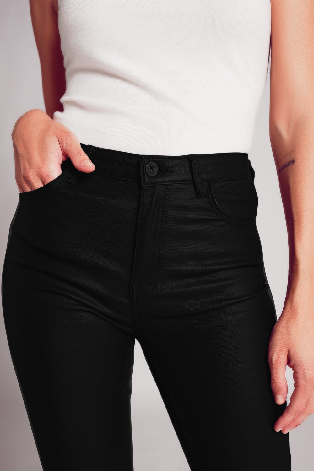 Stretch faux leather flare pants in black