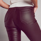 Stretch faux leather flare pants in brown