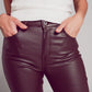 Stretch faux leather flare pants in brown