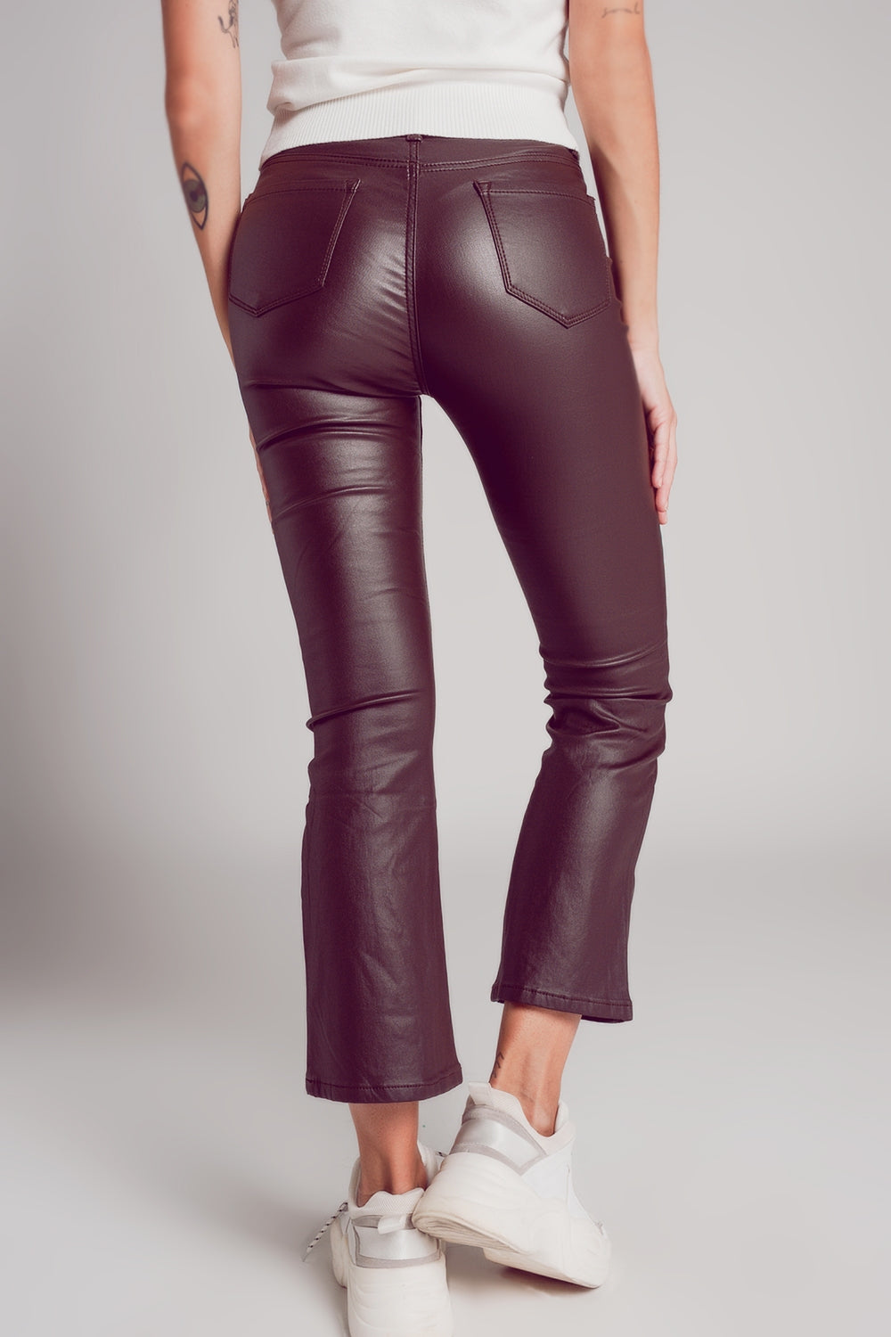 Stretch faux leather flare pants in brown