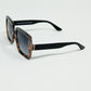 Sunglasses with a brown print frame and black temples