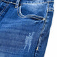 Super skinny jeans in medium wash with rips at the bottom