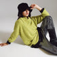 Q2 Sweater in green with a bardot neck.