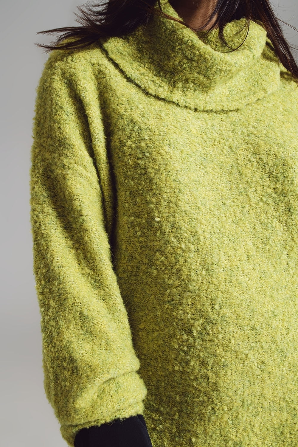 Sweater in green with a bardot neck.