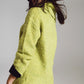 Sweater in green with a bardot neck.