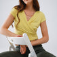 Q2 V-neck crossed drapped fitted top with cap sleeves in light lime