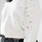 V-neck sweater embellished with metallic stars