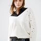 V-neck sweater embellished with metallic stars