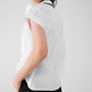 Blusa blanca con botones y strass por todas partes y manga corta