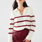 white sweater with dark red stripes and wide v neck