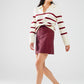 white sweater with dark red stripes and wide v neck