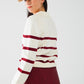 white sweater with dark red stripes and wide v neck