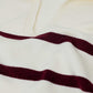 white sweater with dark red stripes and wide v neck