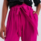 Pantalón fucsia de pernera ancha con cinturón