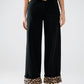 Q2 Wide leg black pants with leopard print at the bottom