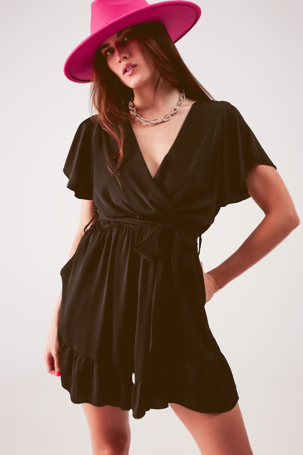 Wrap front frill hem jumpsuit in black