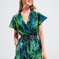 Q2 Wrap jumpsuit in green tropical print