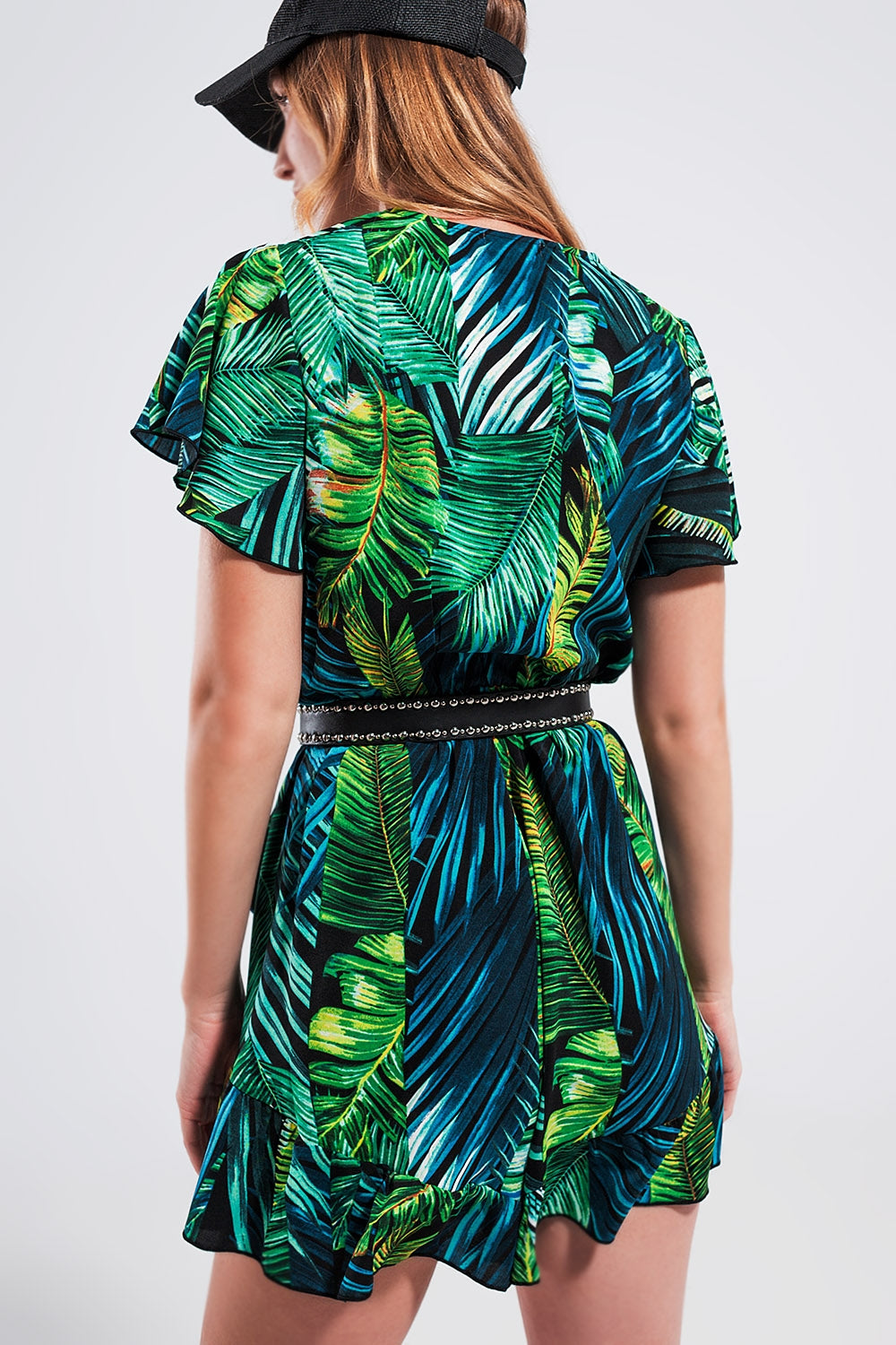 Wrap jumpsuit in green tropical print