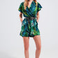 Wrap jumpsuit in green tropical print