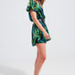 Wrap jumpsuit in green tropical print