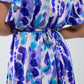 Vestido corto cruzado con efecto tie-dye en azul y morado