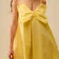 Yellow poplin mini dress with a big bow detail