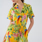 Yellow Short Jumpsuit with Tropical Print and Drawstring Closure