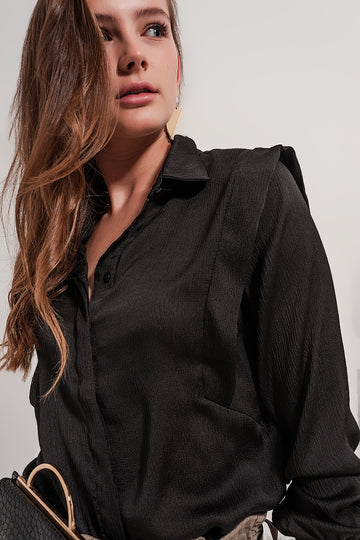 Q2 Black blouse with ruffle details