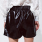 Black faux leather shorts