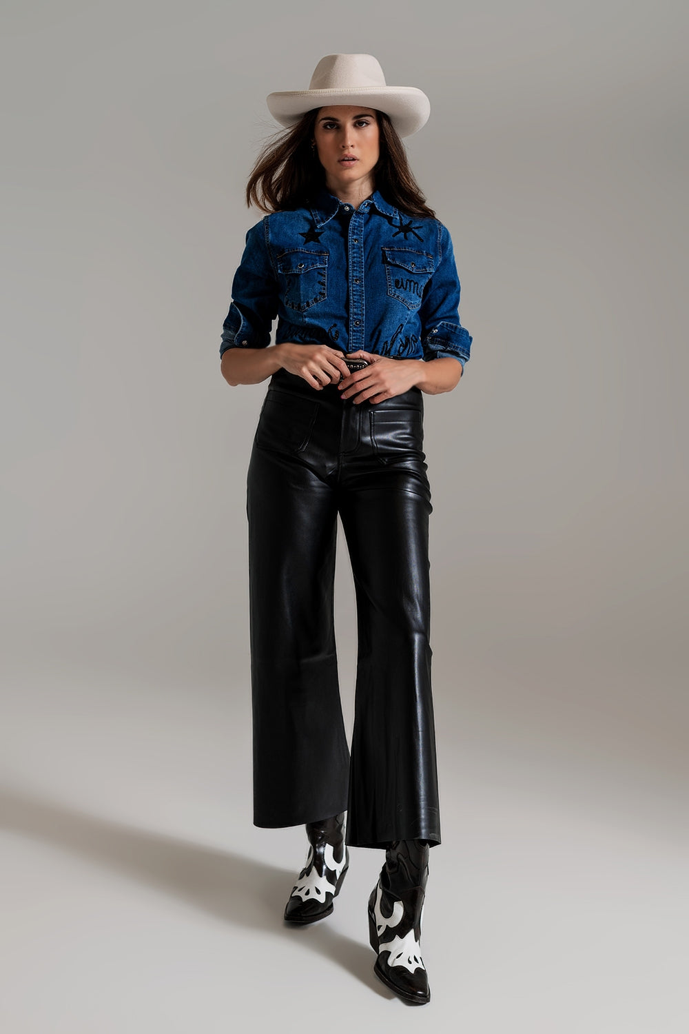 Black palazzo-style faux leather pants with pocket detail