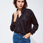 Q2 black satin blouse with rhinestone buttons