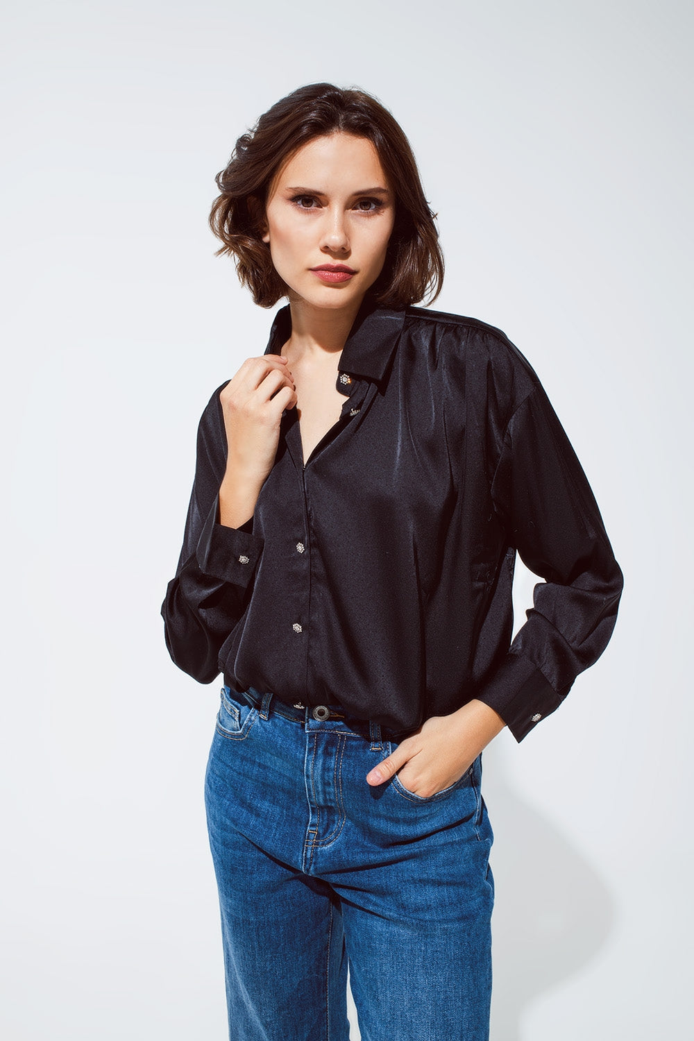 Q2 black satin blouse with rhinestone buttons