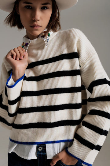 Q2 black striped jumper with blue stripe detail on the bottom